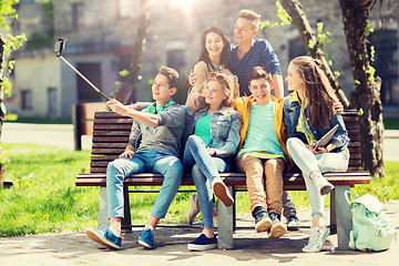 Image showing happy teenage students taking selfie by smartphone