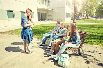 Image showing teenage students with tablet pc at school yard