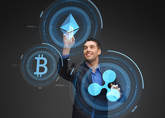 Image showing businessman with cryptocurrency holograms