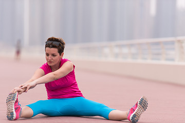 Image showing woman stretching and warming up