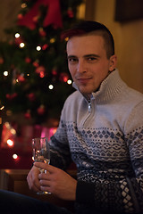 Image showing Happy young man with a glass of champagne