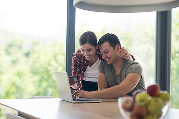 Image showing happy young couple buying online