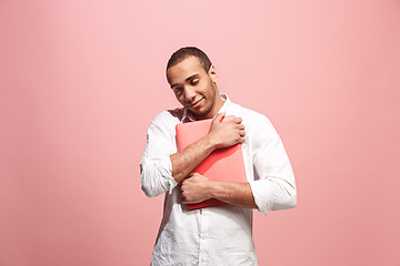 Image showing Businessman hugging laptop