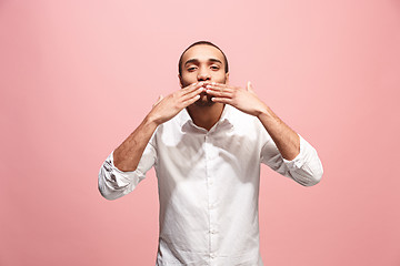 Image showing Portrait of attractive man with kiss isolated over pink background