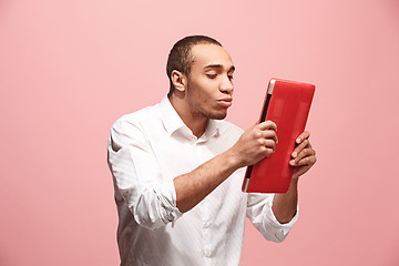 Image showing Businessman hugging laptop