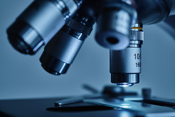 Image showing Modern microscope with metal lens at laboratory.