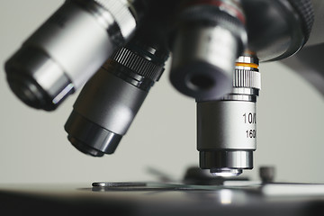 Image showing Modern microscope with metal lens at laboratory.