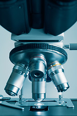 Image showing Modern microscope with metal lens at laboratory.