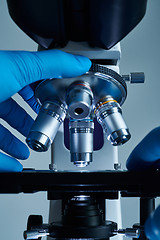 Image showing Scientist hands with microscope