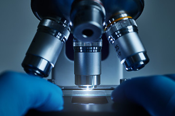 Image showing Scientist hands with microscope