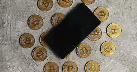 Image showing Smartphone and bticoin on gray background