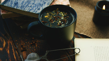 Image showing Cup of tea among books