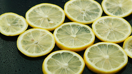 Image showing Sliced lemon on table 