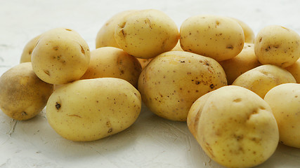 Image showing Unpeeled clean potatoes in closeup