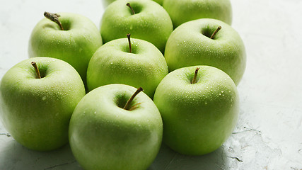 Image showing Ripe green apples in drops