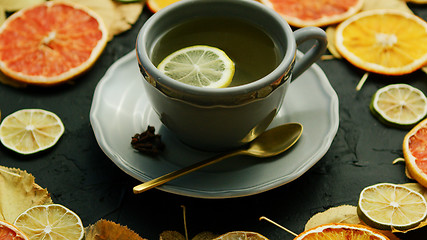 Image showing Cup of tea with lemon and spoon