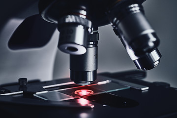 Image showing Modern microscope with metal lens at laboratory.