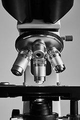 Image showing Modern microscope with metal lens at laboratory.