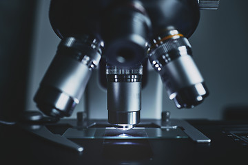 Image showing Modern microscope with metal lens at laboratory.
