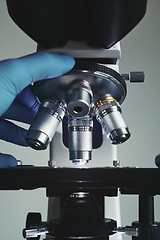 Image showing Scientist hands with microscope