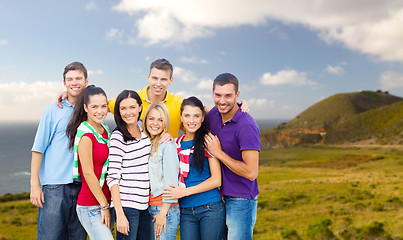 Image showing group of happy friends over big sur coast