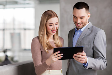 Image showing businesswoman and businessman with tablet pc