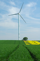 Image showing a windturbine into a green field