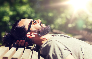 Image showing happy man with earphones listening to music