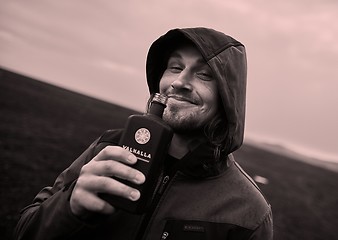 Image showing Hooded man drinking in Iceland