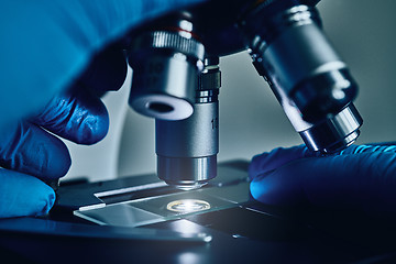 Image showing Scientist hands with microscope