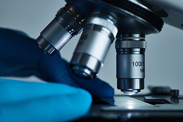 Image showing Scientist hands with microscope