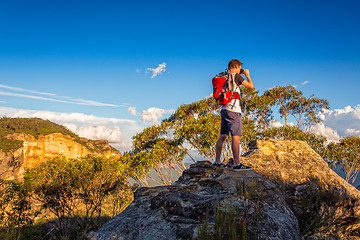 Image showing Looking out across the mountains from a rocky cliff