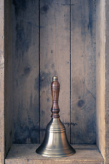 Image showing the bell of Santa Claus with wooden background