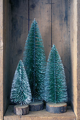 Image showing three Christmas tree objects in a wooden box
