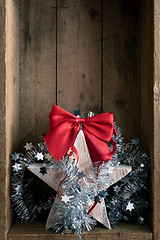 Image showing Christmas decoration wooden star in a wooden box background