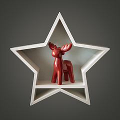 Image showing Christmas decoration white star with red deer inside