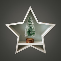 Image showing Christmas decoration white star with fir tree inside