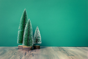 Image showing Christmas decoration green fir trees figure on green backgound