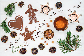 Image showing Nordic Christmas decor with candles, tea and ginger biscuits