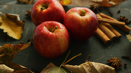 Image showing Apples with condiments on table