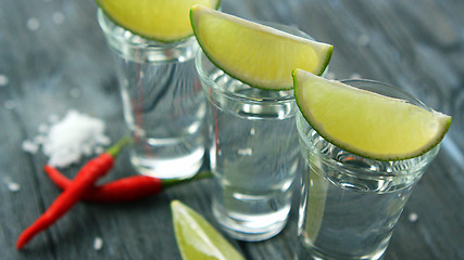 Image showing Served shots with tequila and lime slices