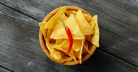 Image showing Bowl of corn chips and chili pepper