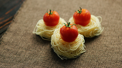 Image showing Rolled spaghetti with tomatoes