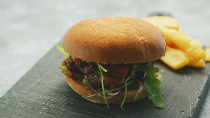 Image showing Juicy delicious burger on plate