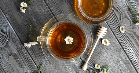 Image showing Herbal tea and jar of honey