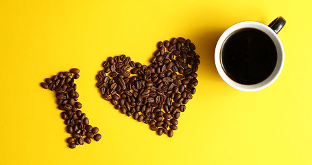 Image showing Cup of coffee and brown beans