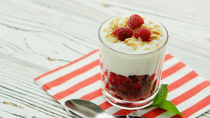 Image showing Glass with yogurt and raspberry