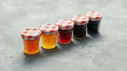 Image showing Small cups with different marmalade