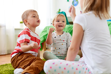 Image showing kids playing rock-paper-scissors game at home