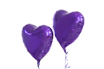 Image showing close up of helium balloons over white background